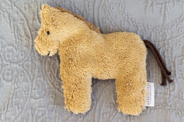 Värmedjur för bäbisar, hästen Holly av ekologiskt teddytyg, med druvkärnorfyllning